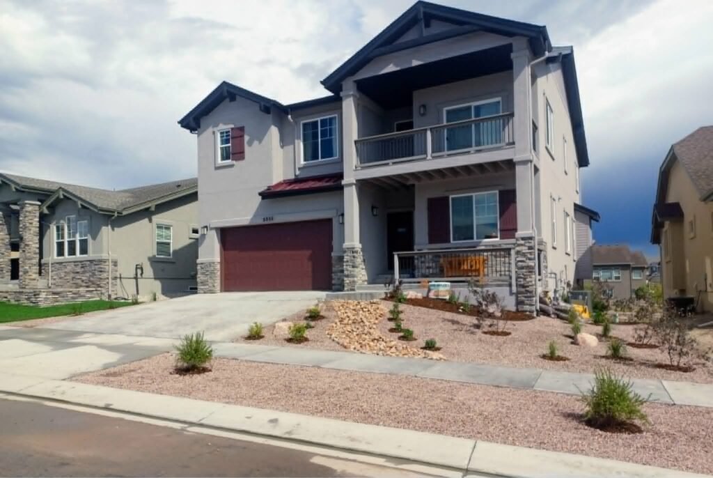 Front yard transformation from unfinished dirt to polished xeriscape with plants and rock

