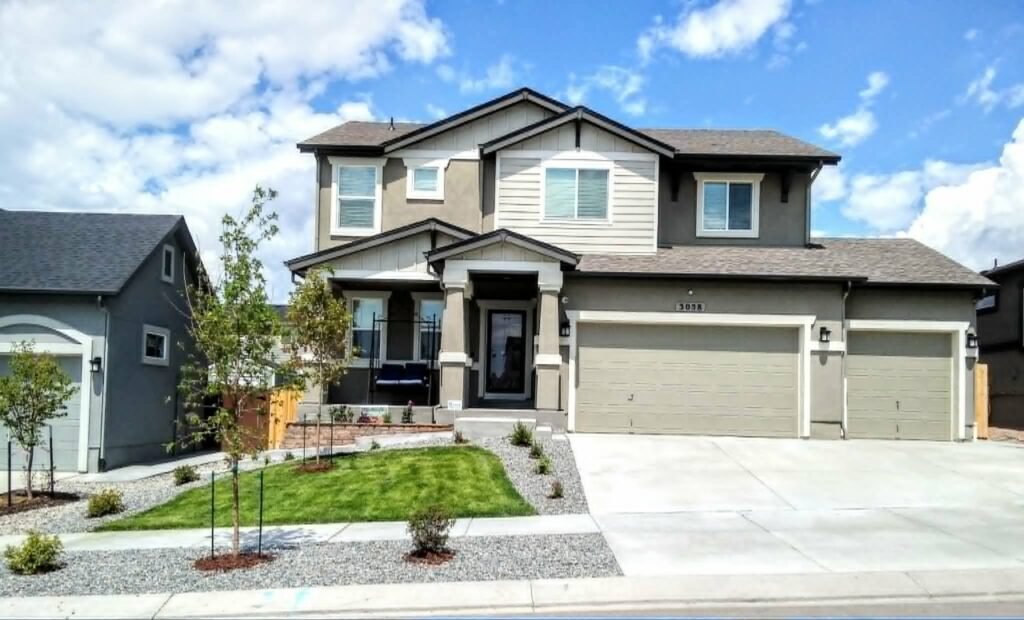 Front yard transformation from unfinished dirt to polished xeriscape with plants and rock

