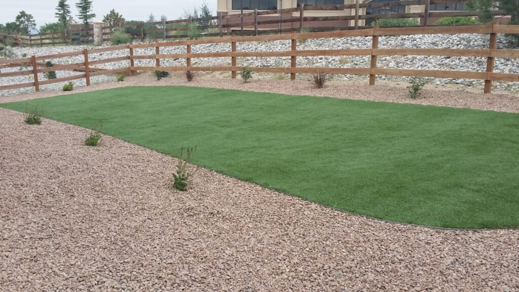 Front yard transformation from unfinished dirt to polished xeriscape with plants and rock

