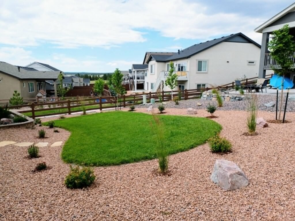 Water-wise xeriscape front yard featuring native shrubs, mulch, and drip irrigation

