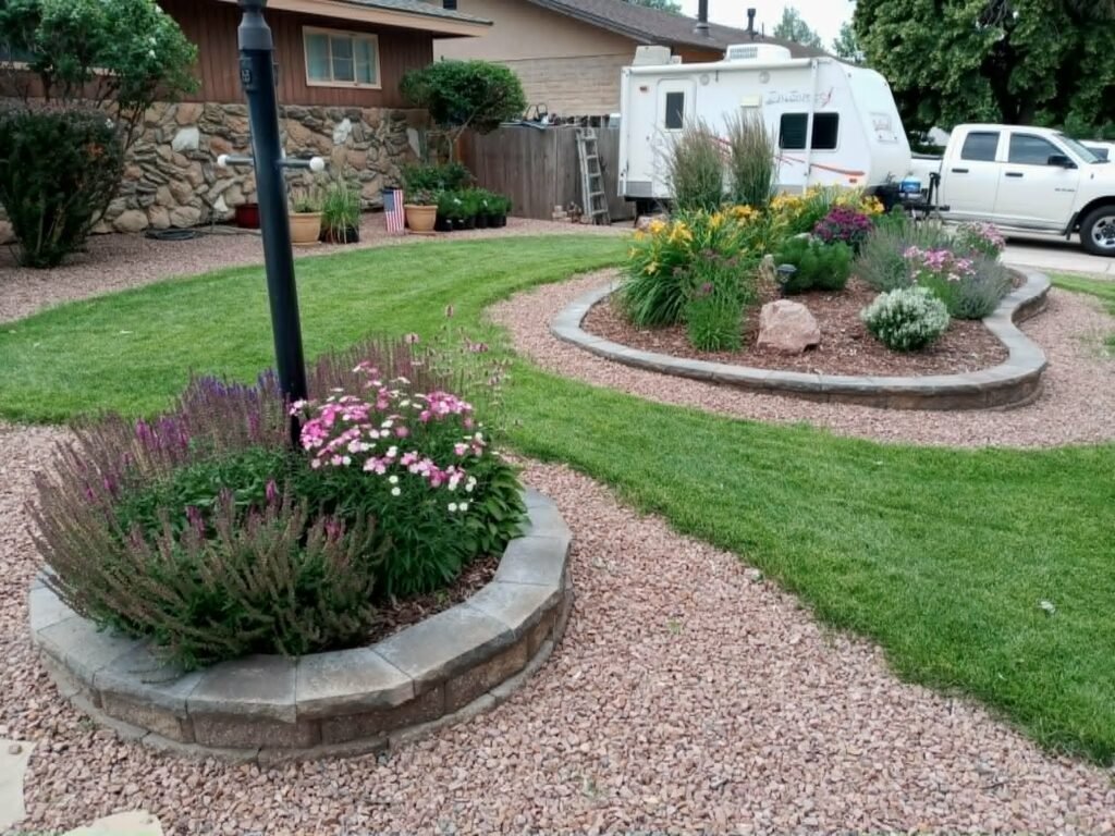 Segmental block retaining wall with drainage gravel and landscape lighting


