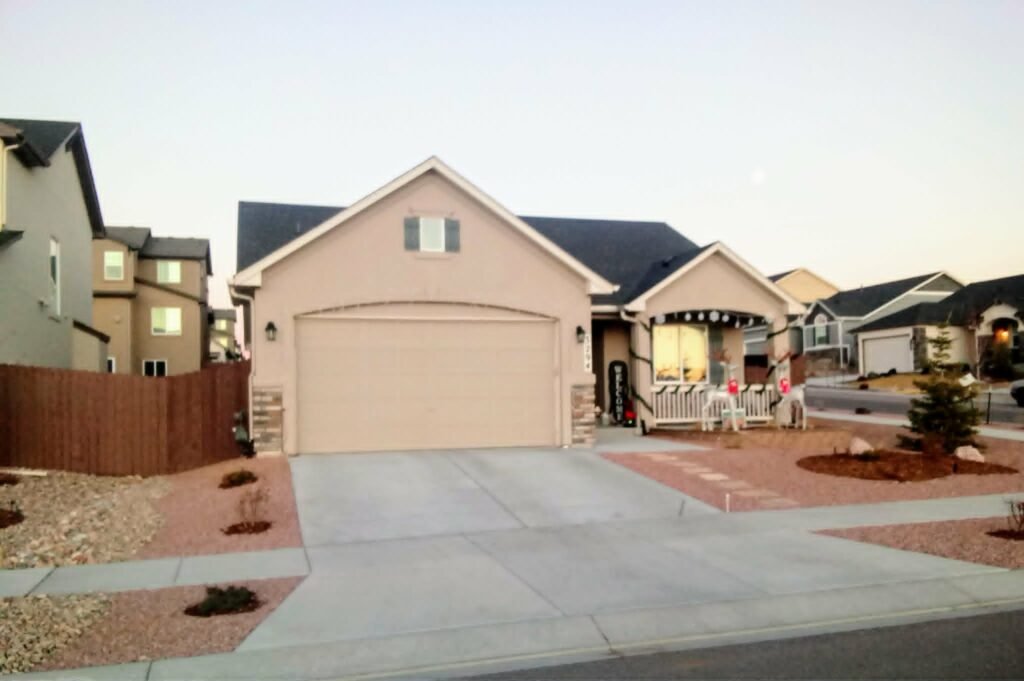 Water-wise xeriscape front yard featuring native shrubs, mulch, and drip irrigation

