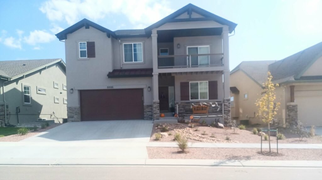 Front yard transformation from unfinished dirt to polished xeriscape with plants and rock

