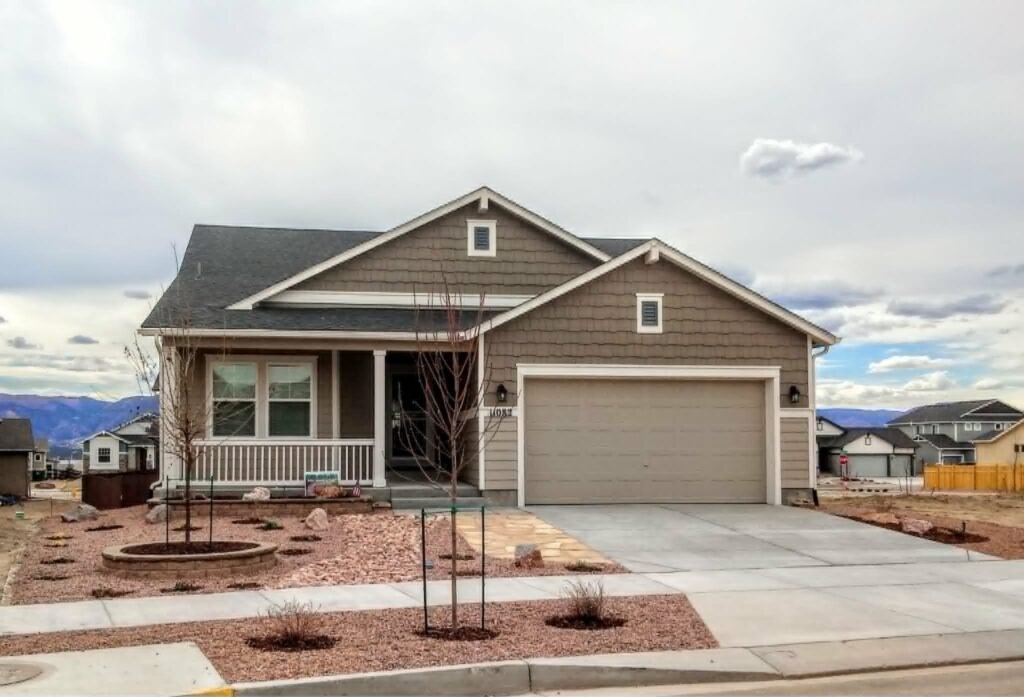Water-wise xeriscape front yard featuring native shrubs, mulch, and drip irrigation

