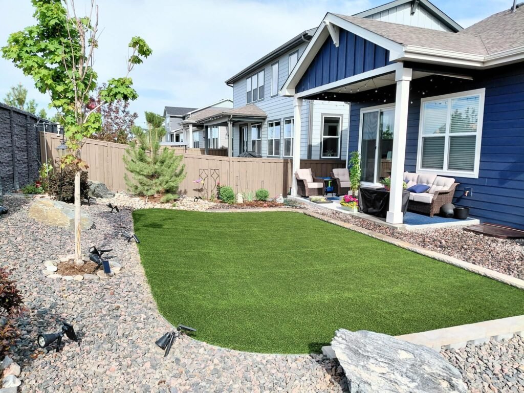 Front yard transformation from unfinished dirt to polished xeriscape with plants and rock

