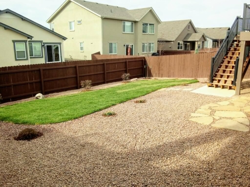 Water-wise xeriscape front yard featuring native shrubs, mulch, and drip irrigation

