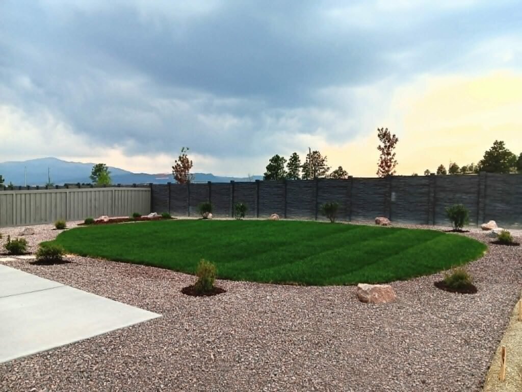 Front yard transformation from unfinished dirt to polished xeriscape with plants and rock

