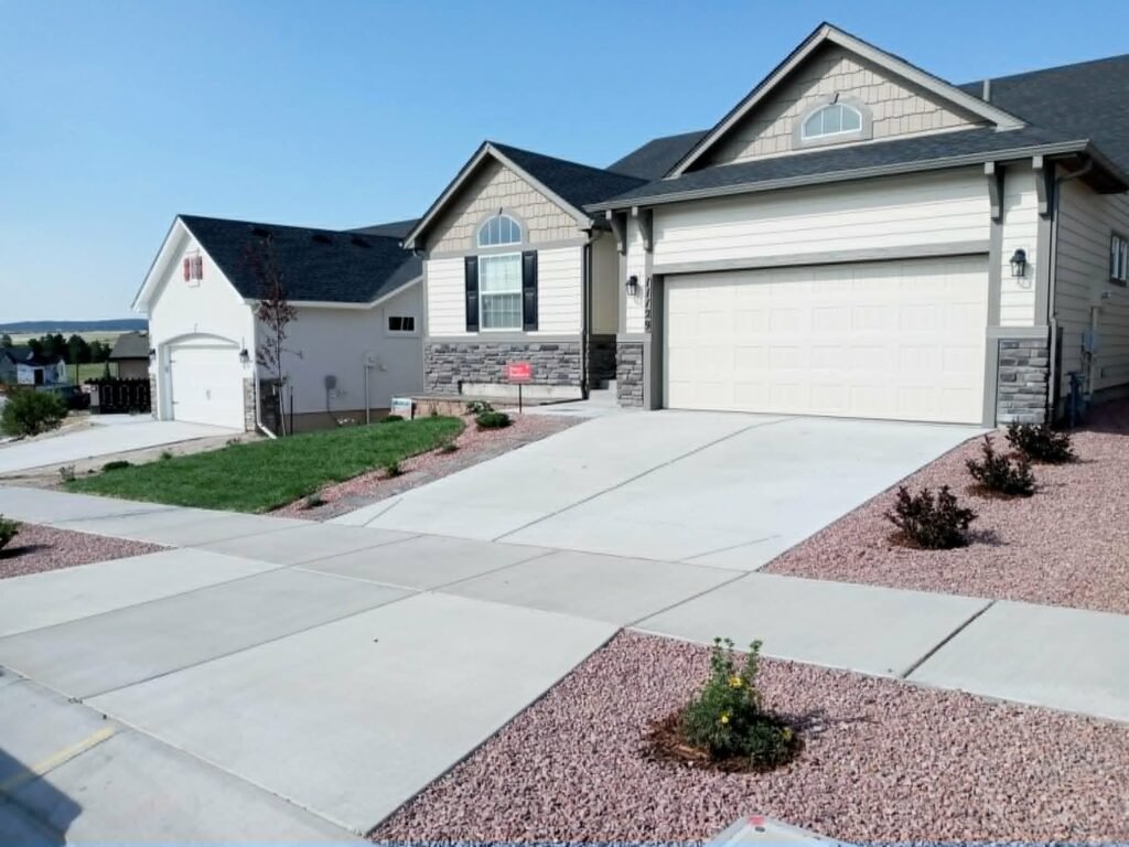 Water-wise xeriscape front yard featuring native shrubs, mulch, and drip irrigation

